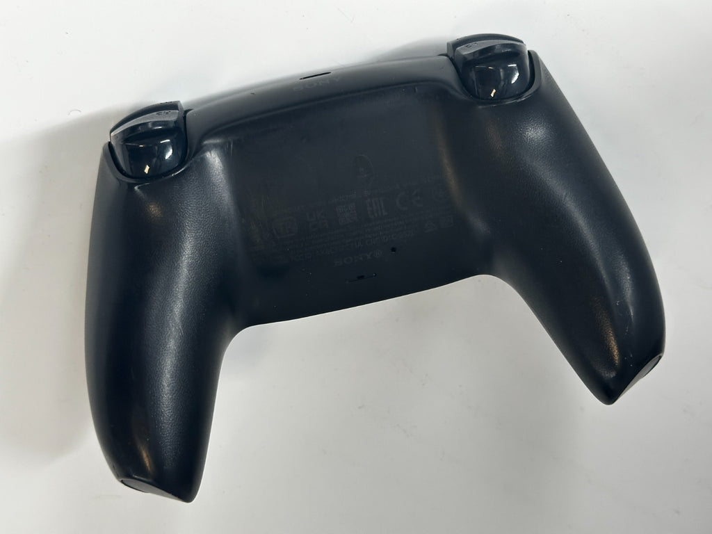 Back of a black PlayStation 5 DualSense controller on a white background.