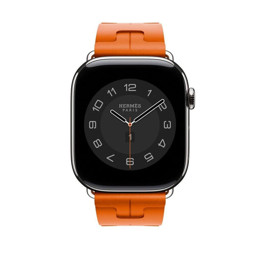 Stainless steel Apple Watch Hermès with a vibrant orange sport band.