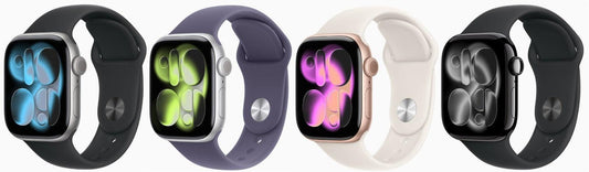 Four Apple Watches with silver, rose gold, and black cases, and colorful silicone bands.